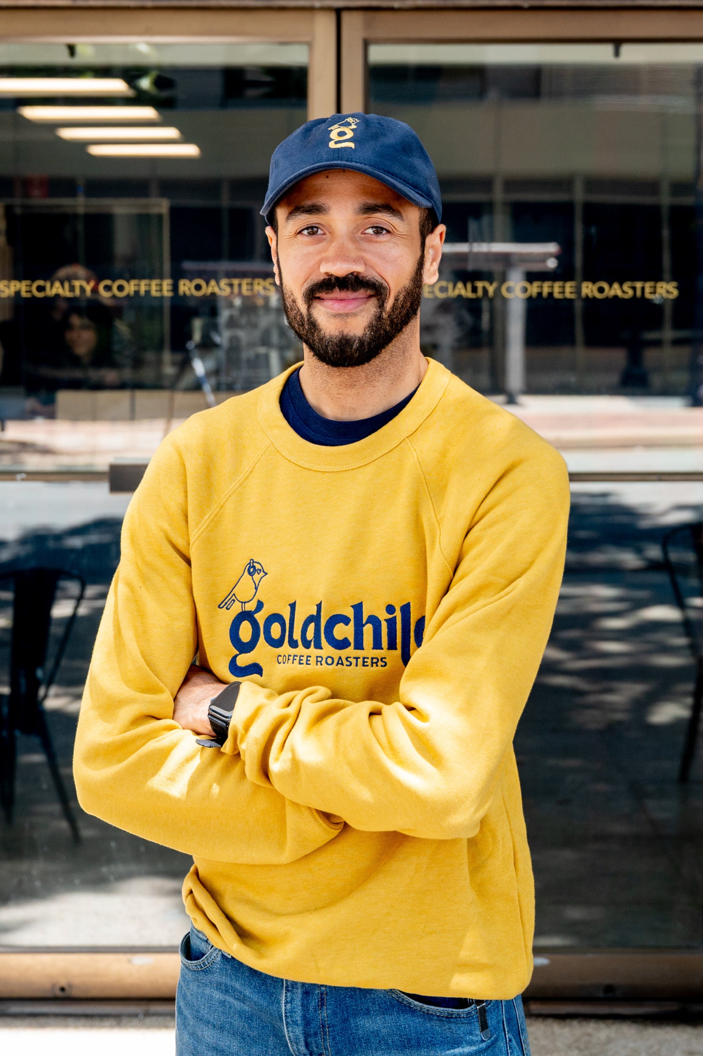 Jeff Rambo, co-founder of Goldchild Coffee, standing in front of the shop